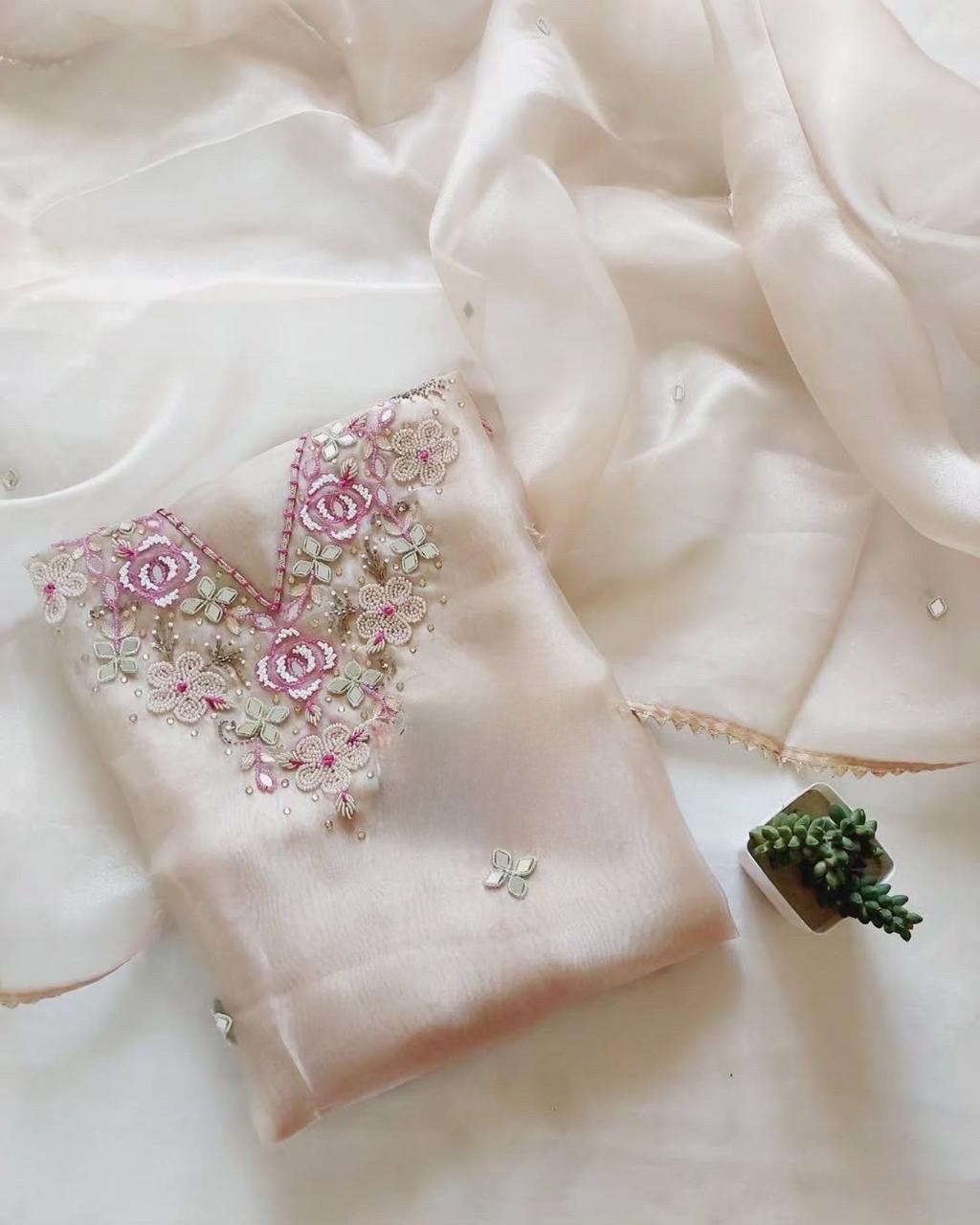 Off White Organza Suit With Heavy Pearl Neck Work