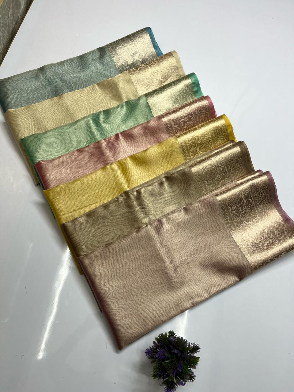 Colors available in soft tissue saree: blue, gold, green,pink, yellow, brown, ivory