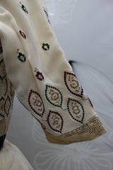 Cream Embroidery And Sequin Semi Stitched Lehenga